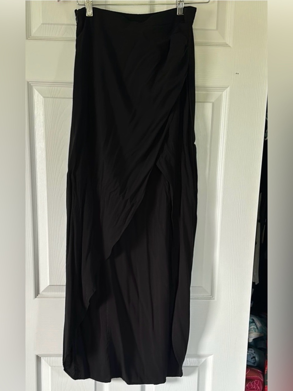 Black Women maxi skirt with asymmetrical hem. Zippered side